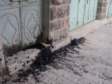 Tar and feathers thrown into a Palestinian market by Israeli settlers living above.