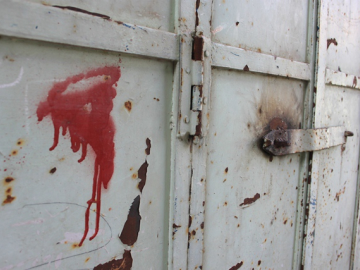 A red spot and welded lock marks the shops which have been closed by military order.